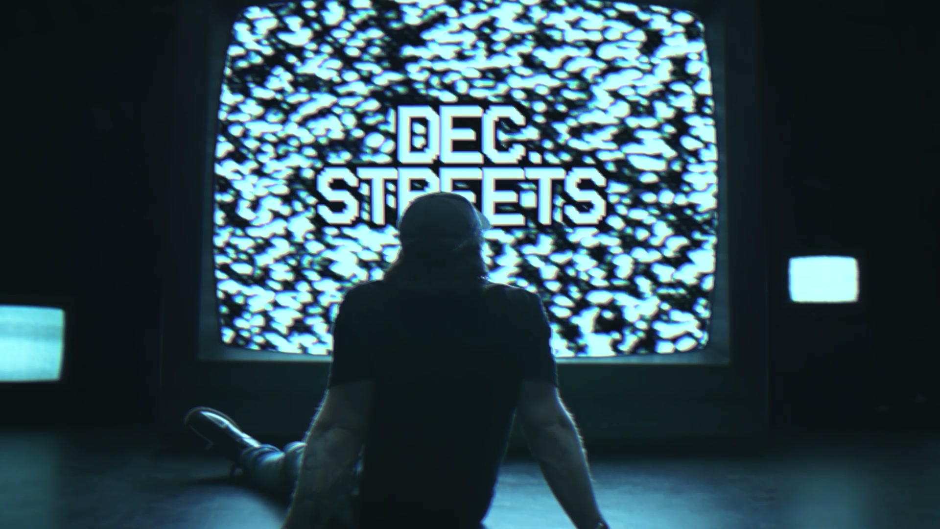 DEC. STREETS logo on a static filled TV